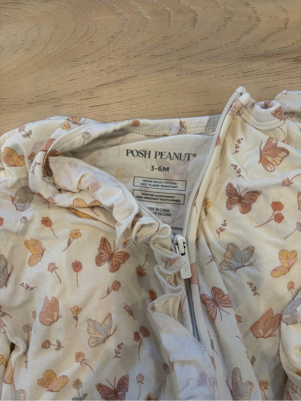 Posh Peanut Cream Romper with Peach & Yellow Butterfly Print
